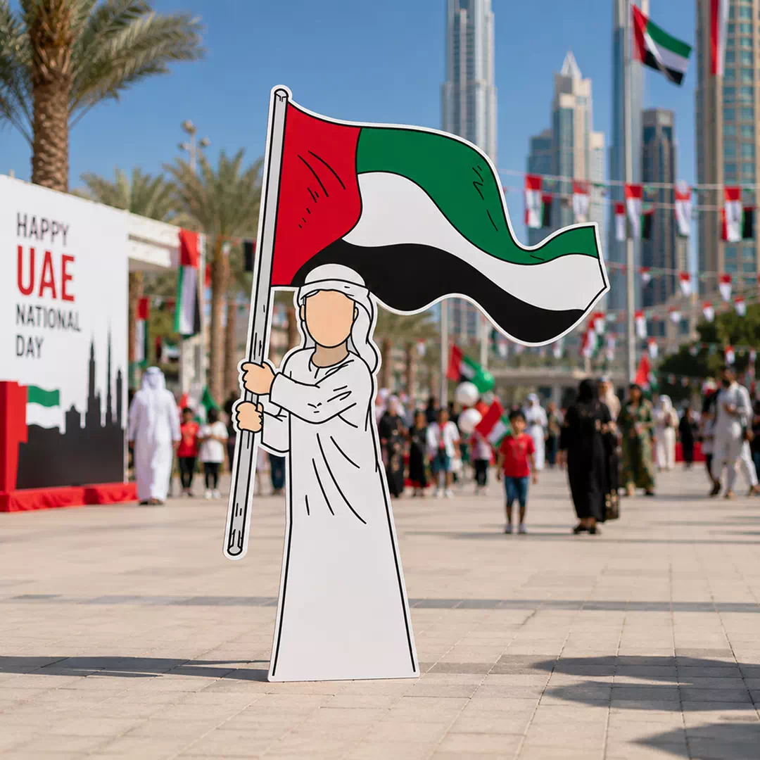 Illustrated Emirati Man in White Kandura Holding Large UAE Flag Character Cutout