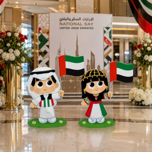 Illustrated Emirati Children in Traditional Attire Waving UAE Flags Cutout Set